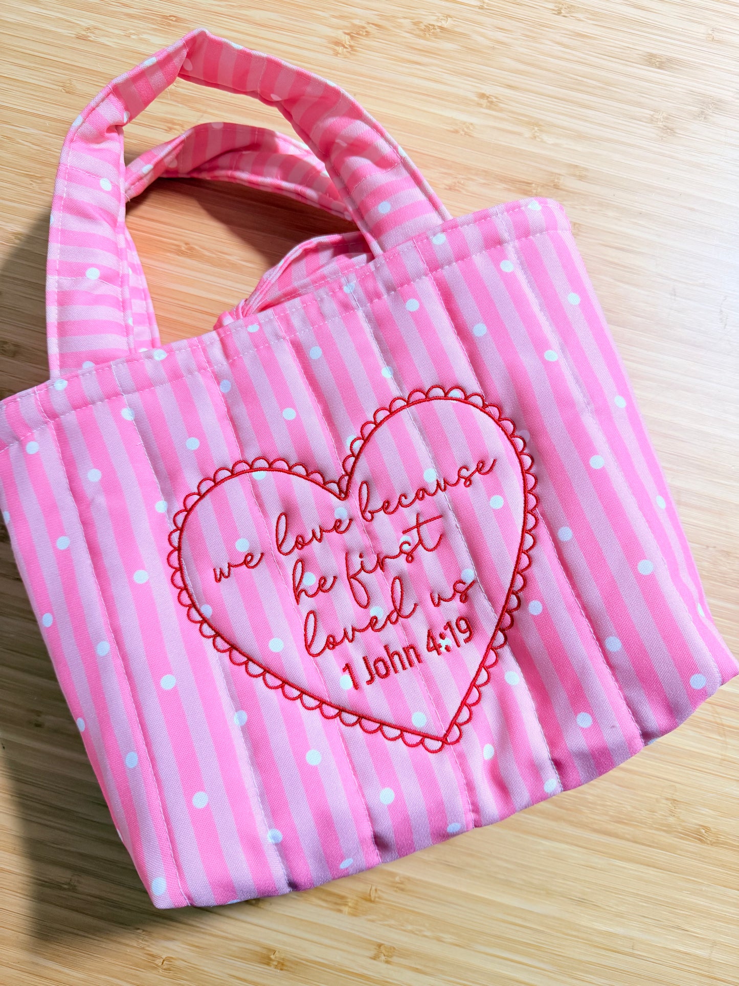 WE LOVE BECAUSE HE FIRST LOVED US EMBROIDERED MINI TOTE
